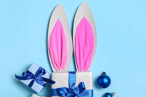 Paper Bunny Ears Christmas Balls Gifts Blue Background — Stock Photo, Image
