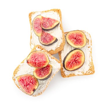 Krem peynirli lezzetli bruschettalar ve beyaz arka planda incirler.