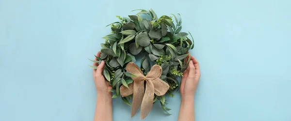 Female Hands Stylish Christmas Wreath Light Blue Background — Stock Photo, Image