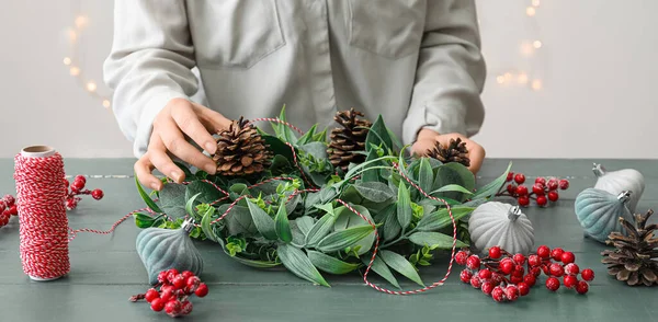 Woman Making Beautiful Christmas Wreath Wooden Table — Stock Photo, Image