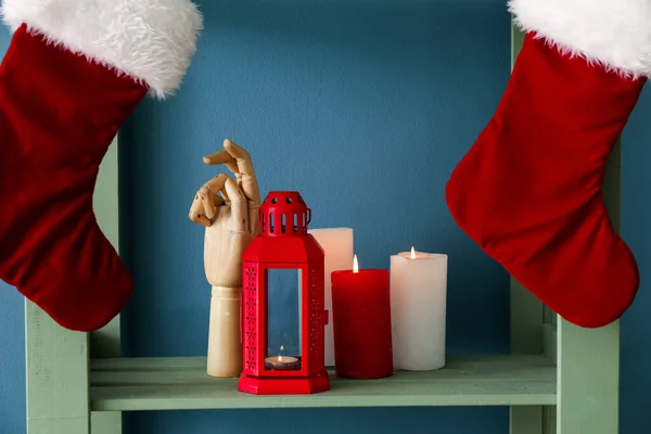 Shelving Unit Christmas Socks Lantern Candles Wooden Hand Blue Wall — Stock Photo, Image