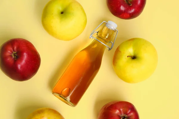 Stock image Composition with ripe apples and bottle of fresh juice on color background