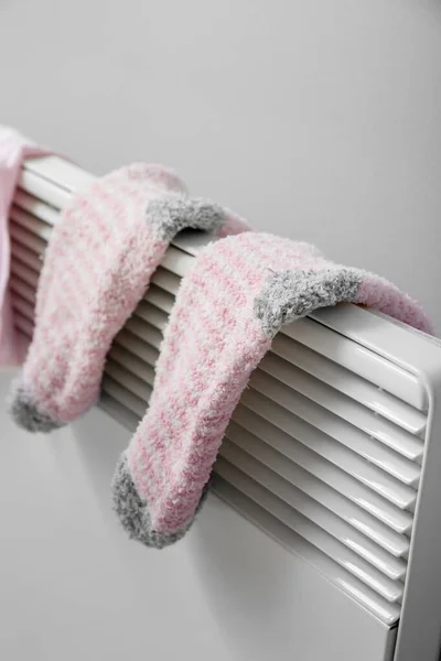 Warm Socks Drying Electric Radiator Light Wall Closeup — Stock Photo, Image