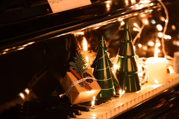 Gift Christmas Decor Candles Glowing Lights Piano Keys Closeup — Stock Photo, Image