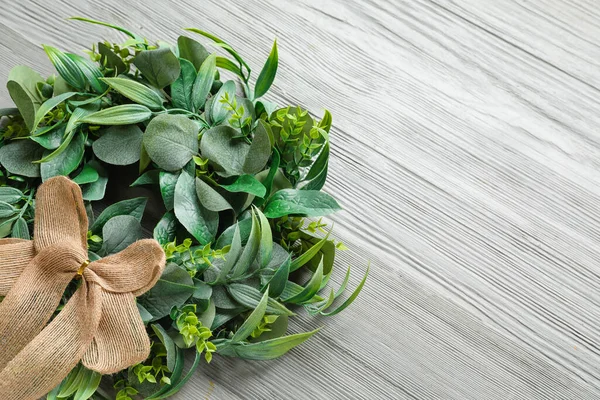 stock image Beautiful Christmas wreath on grey wooden background