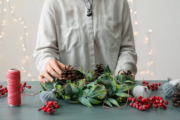 Woman Making Beautiful Christmas Wreath Color Wooden Table — Stock Photo, Image