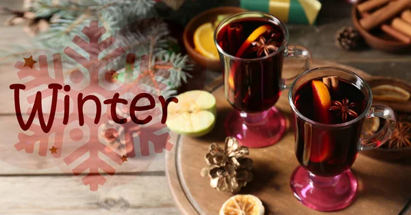 Banner with tasty mulled wine and text WINTER on wooden background