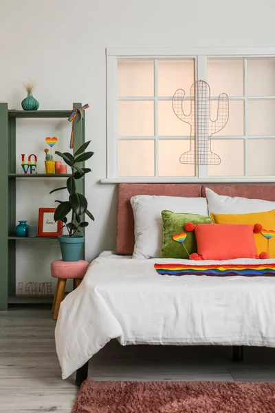Comfortable Bed Houseplant Shelving Unit Rainbow Flags Room — Stock Photo, Image