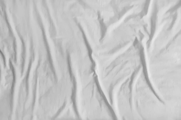 White crumpled bed sheet, closeup