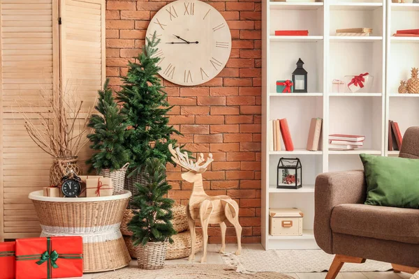 Interior of living room with clocks, Christmas trees and wooden reindeer