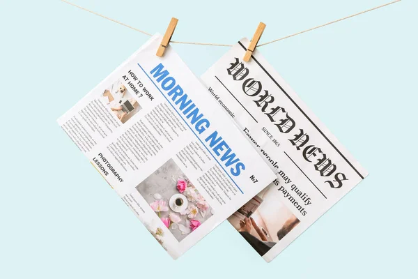 Newspapers Hanging Rope Color Background — Stock Photo, Image