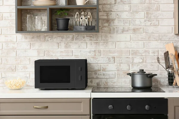 Dark Microwave Oven Counter Light Brick Wall Kitchen — Stock Photo, Image