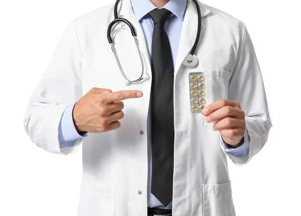 Médico Masculino Señalando Vitaminas Sobre Fondo Blanco —  Fotos de Stock
