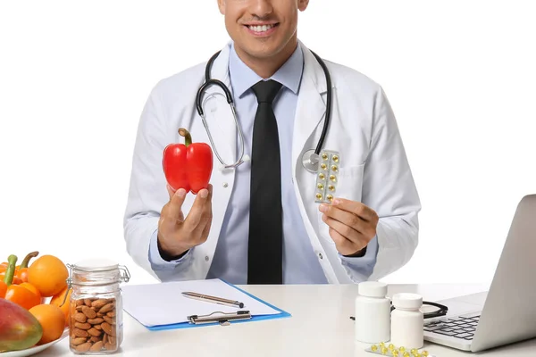 Male Doctor Vegetables Vitamins Sitting Table White Background — Stock Photo, Image