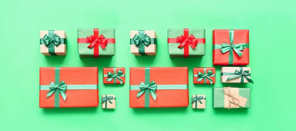 Beautiful Christmas Gifts Green Background Top View — Stock Photo, Image