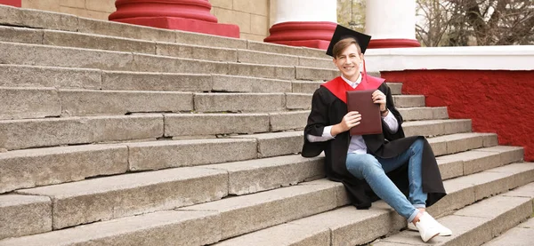 Male Graduating Student Sitting Stairs Outdoors — Stock Photo, Image