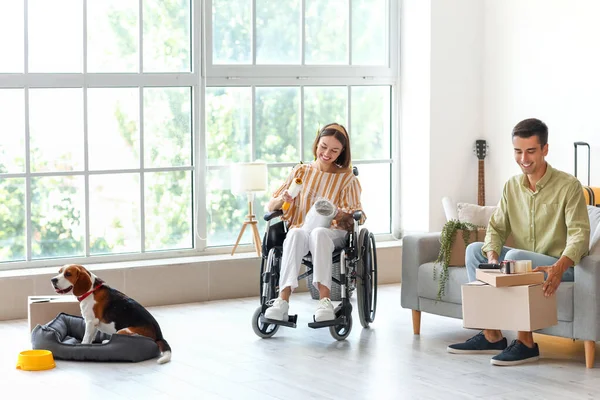 Young Man His Wife Wheelchair Dog Packing Things Room Moving — Stock Photo, Image