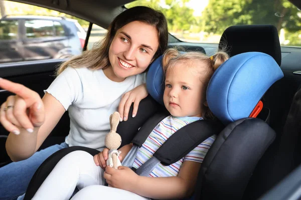 Mother Her Little Daughter Toy Buckled Car Safety Seat — Stock Photo, Image