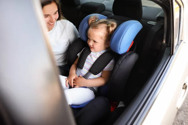 Mother Her Little Daughter Buckled Car Safety Seat — Stock Photo, Image