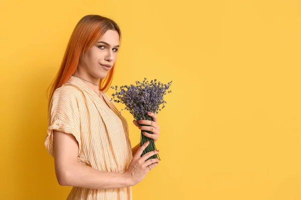 Young Transgender Woman Beautiful Manicure Lavender Flowers Yellow Background — Stock Photo, Image