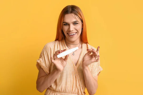 Young Transgender Woman Beautiful Manicure Nail File Yellow Background — Stock Photo, Image