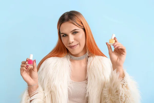 Young Transgender Woman Nail Polishes Blue Background — Stock Photo, Image