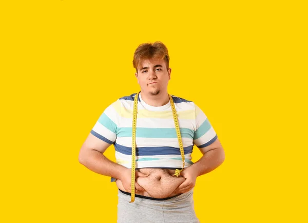Upset Young Overweight Man Measuring Tape Yellow Background — Stock Photo, Image
