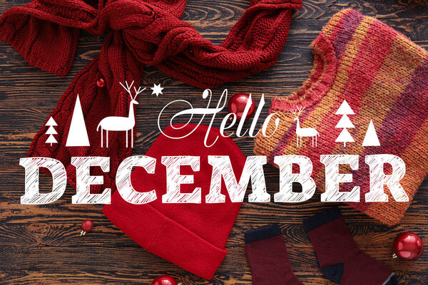 Banner with stylish winter clothes and text HELLO DECEMBER