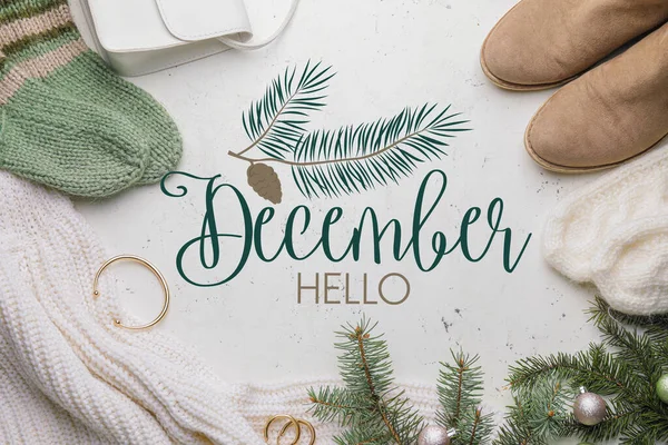 Banner with stylish winter clothes, accessories and text HELLO DECEMBER