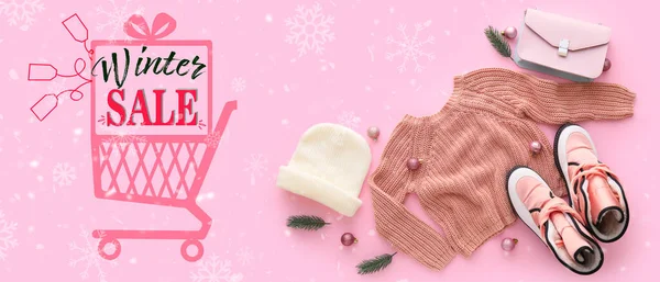 Banner for winter sale with warm clothes on pink background
