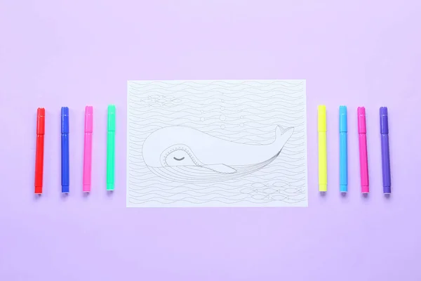 Coloring page and felt-tip pens on pink background
