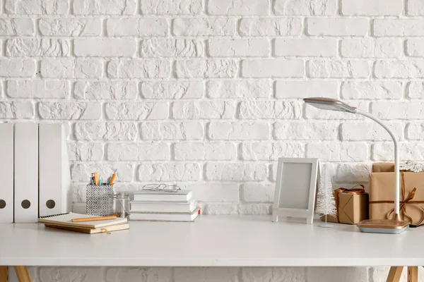 Workplace Frame Books Lamp Christmas Presents White Brick Wall — Stock Photo, Image