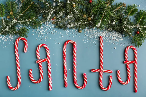 Word Santa Made Candy Canes Fir Branches Snow Color Background — Stock Photo, Image