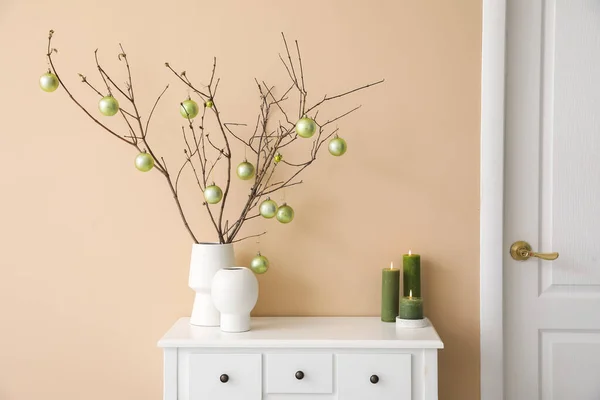 Vases Tree Branches Christmas Balls Candles Table Beige Wall — Stock Photo, Image