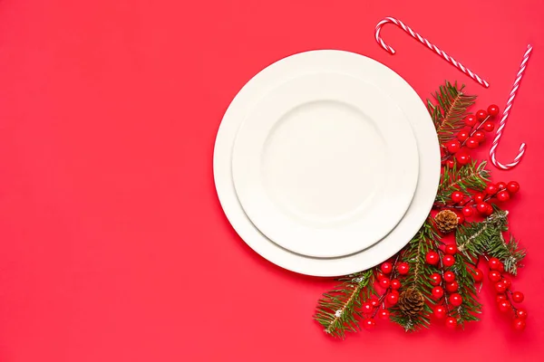White Plates Christmas Branches Cranberry Candy Canes Red Background — Stock Photo, Image