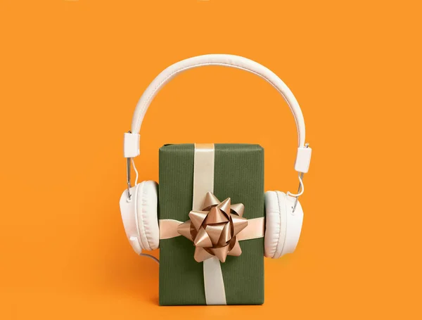 Headphones Christmas Gift Orange Background — Stock Photo, Image