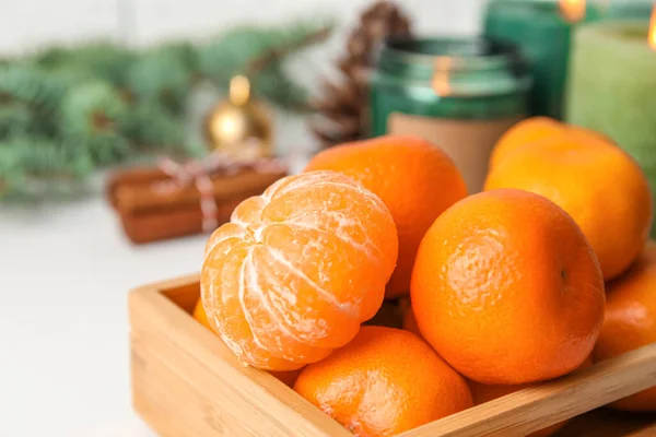 stock image Wooden box with fresh ripe tangerines on table, closeup