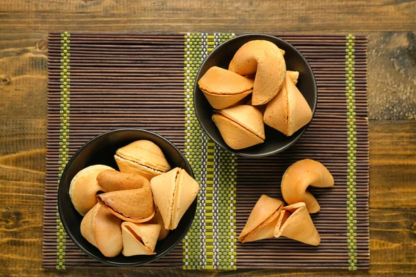 Bamboo Mat Bowls Fortune Cookies Wooden Background — Stock Photo, Image