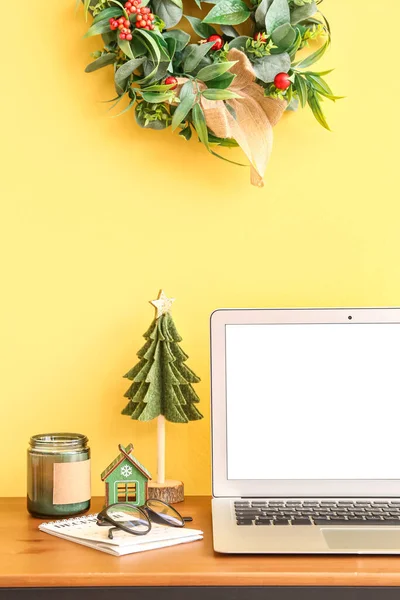 Laptop Christmas Toys Candle Table Yellow Wall — Stock Photo, Image