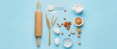 Açık mavi zemin üzerinde fırın ve merdane pimi hazırlamak için gerekenler