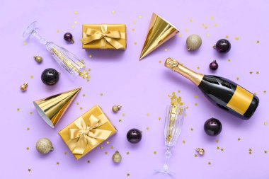 Parti şapkalarından yapılmış çerçeve, Noel hediyeleri, balolar ve leylak arkaplanda şampanya