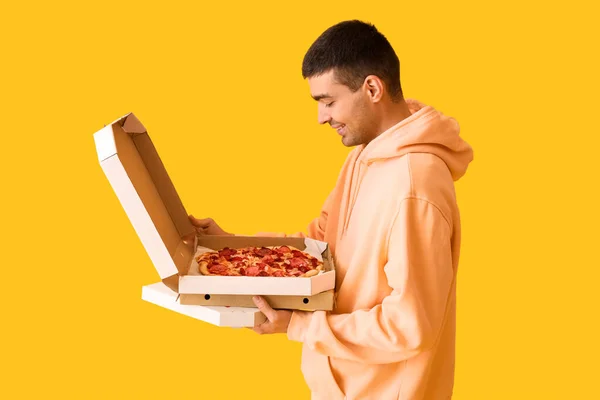 Handsome Young Man Holding Boxes Fresh Pizza Yellow Background — Stock Photo, Image