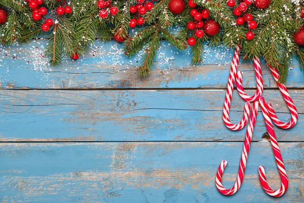 Composition Candy Canes Fir Branches Christmas Decor Color Wooden Background — Stock Photo, Image