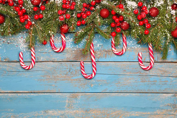 Composition Candy Canes Fir Branches Christmas Decor Color Wooden Background — Stock Photo, Image