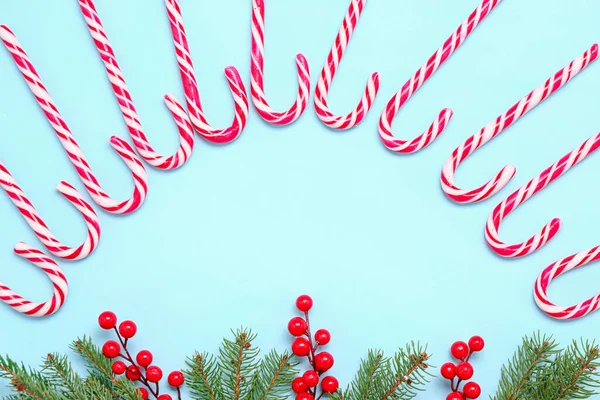 Composition Sweet Candy Canes Fir Branches Cranberry Color Background — Stock Photo, Image