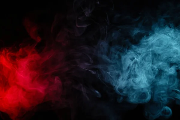Red and blue smoke on black background