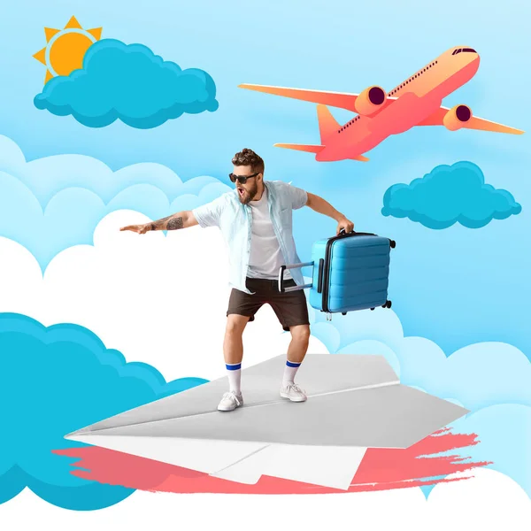 空に描かれた紙飛行機にスーツケースを着た若い男 休暇の概念 — ストック写真