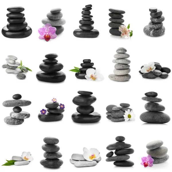 Set of spa stones and beautiful flowers on white background