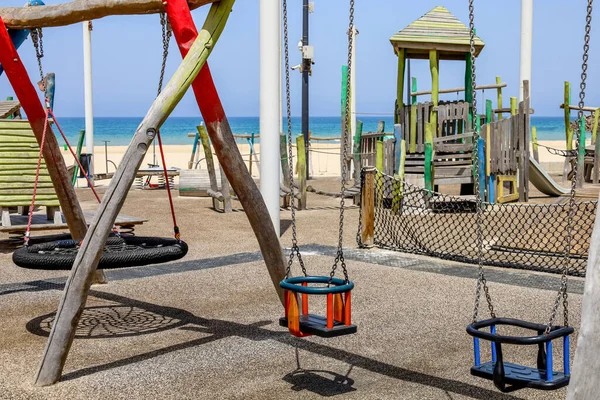 View Children Swings Playground Sea — Stock Photo, Image