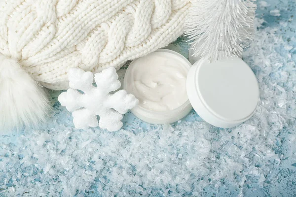 Jar Cream Christmas Decorations Warm Hat Snow Color Background — Stock Photo, Image
